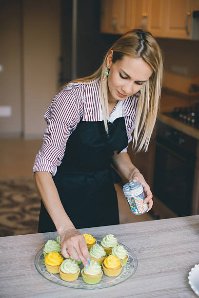 istock Young woman chef cooking cake in kitchen 545637724