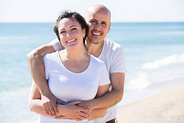 istock Couple embracing on the beach 545637974
