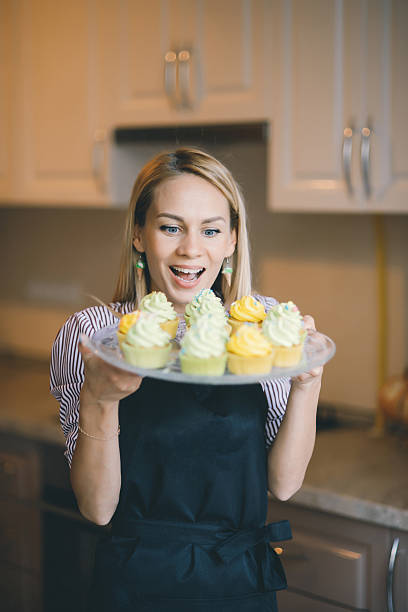 istock Young woman chef cooking cake in kitchen 545638348