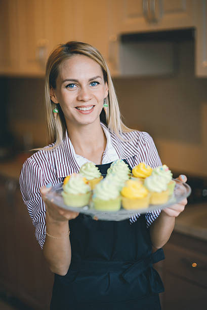 istock Young woman chef cooking cake in kitchen 545638392