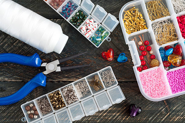 istock Handmade accessories. Box with beads, pliers and thread 545639374