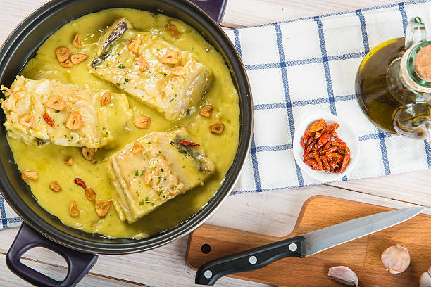 Salt cod in a pilpil sauce Salt cod in a pilpil sauce a typical Spanish recipe turbot stock pictures, royalty-free photos & images