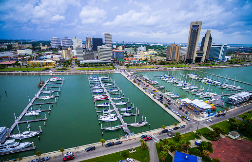 Corpus Christi Texas aerial shot over the marina and T-head with boat after boat and pier after pier . Yacht's , sailboats , and speedboats , the coastal Texas city on the gulf of mexico 