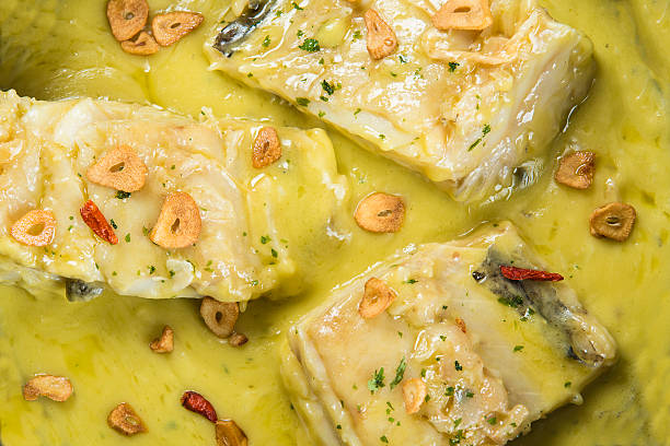 Salt cod in a pilpil sauce stock photo