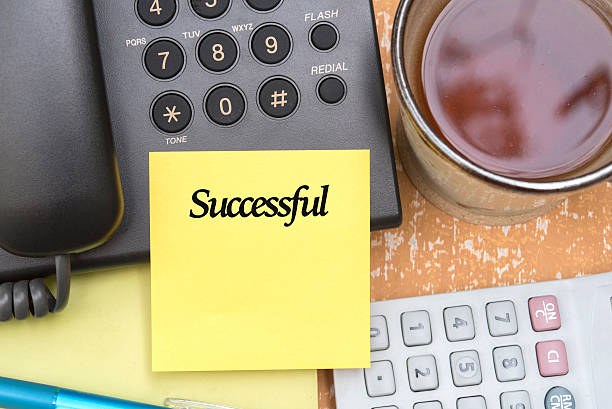 istock note paper stick on telephone with word successful 545640374