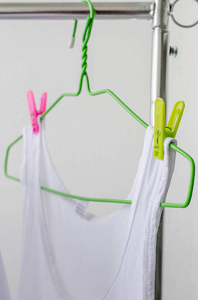 istock white shirts drying on a clothes line. 545640516