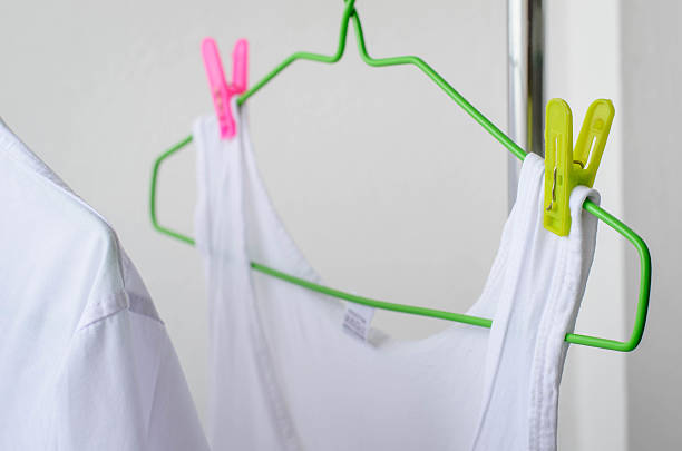 istock white shirts drying on a clothes line. 545640554