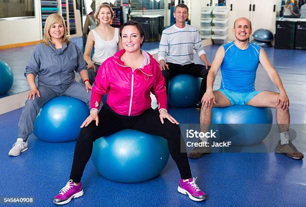 Adults Doing Aerobics With Balls Stock Photo - Download Image Now - 40-44 Years, 50-54 Years, 60-64 Years
