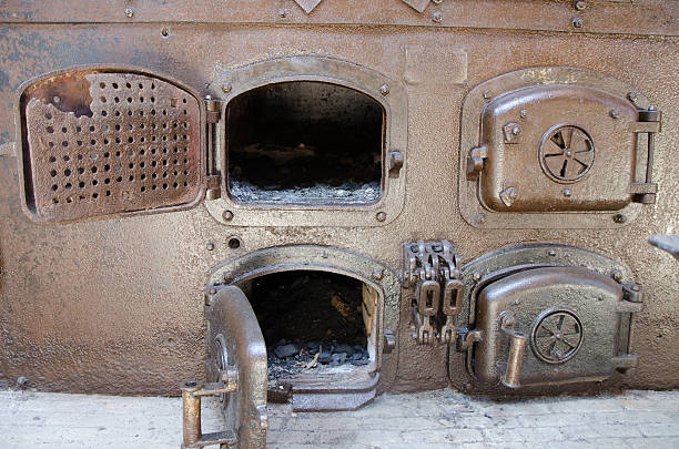 istock Four coal rusty furnaces with doors opened and closed 545641450
