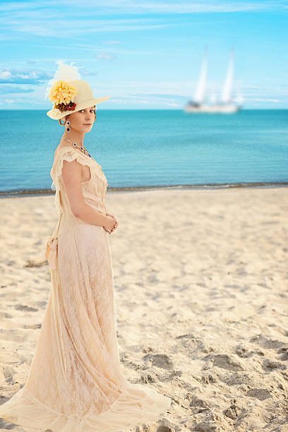 istock victorian woman at the beach 545642038