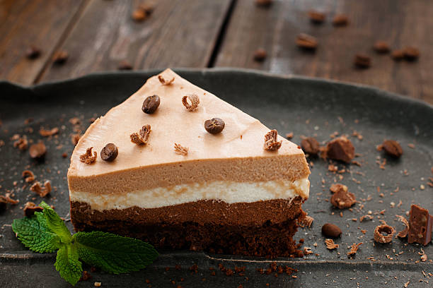 istock Tasty layered chocolate biscuit on black plate 545642162