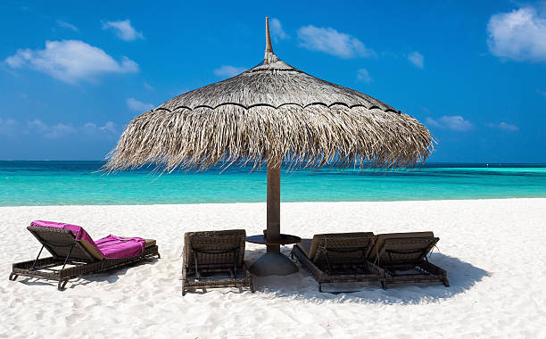 istock Umbrella and sun-chairs on Maldivian beach 545642852