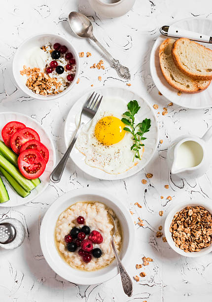 istock Breakfast - egg, vegetables, oatmeal, berries, cottage cheese, yogurt, granola 545646386
