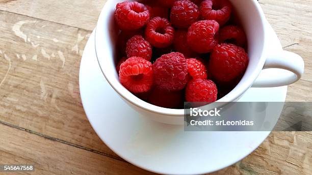 Raspberries Stock Photo - Download Image Now - Cup, Food, Fruit