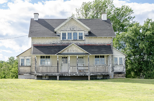 Face of old abandoned houses on a summer day