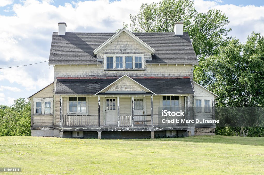 Facade of old abandoned houses on a summer day Face of old abandoned houses on a summer day House Stock Photo