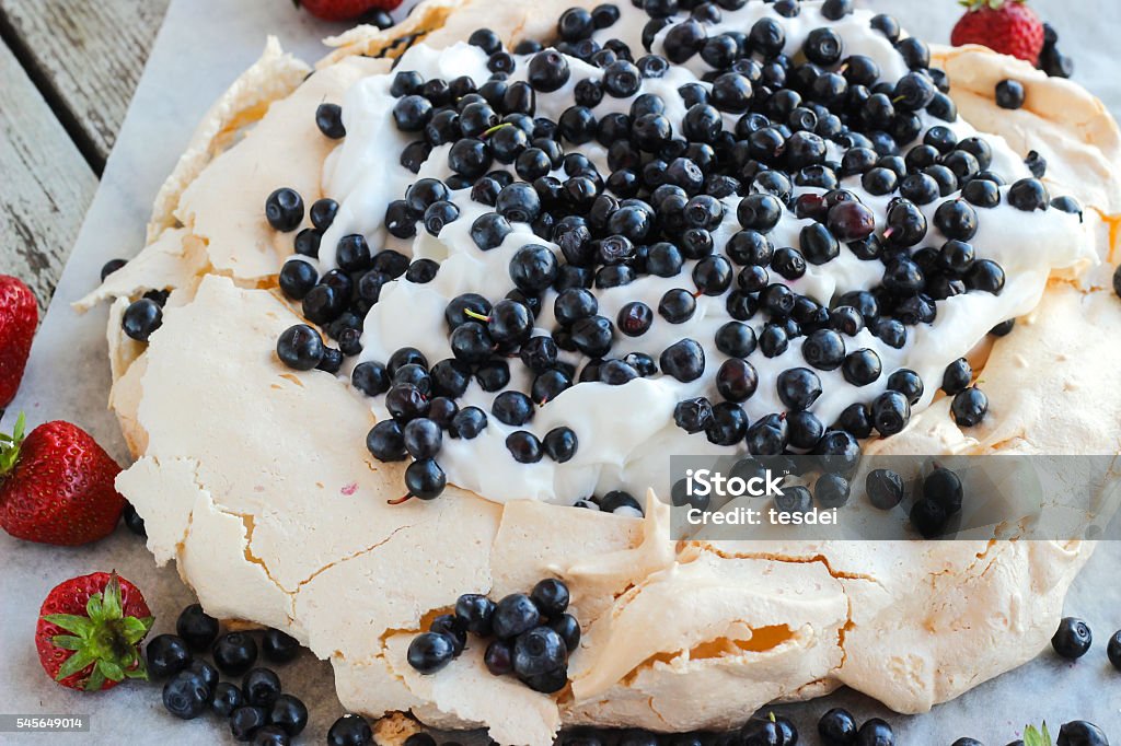 Meringue cake Pavlova with blueberry Meringue cake Pavlova with blueberry and whipped cream Baked Stock Photo