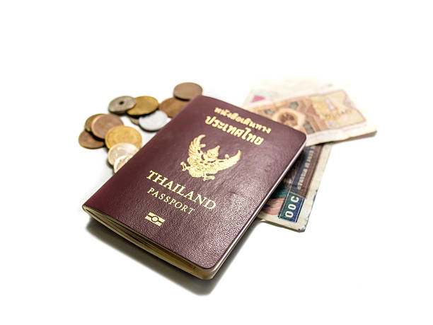 istock Isolated passport banknotes and coins 545650628