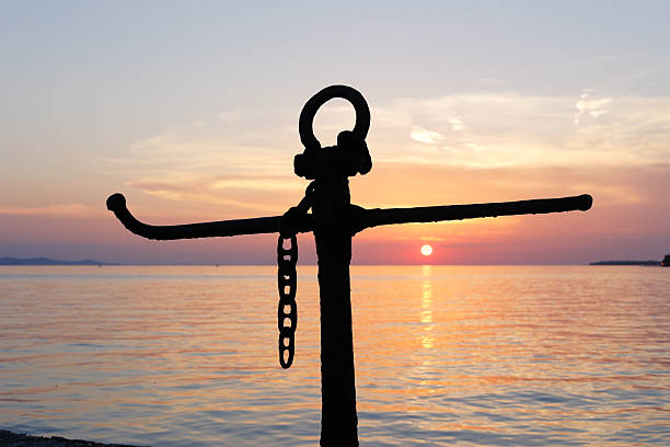 Anchor silhouette on a sunset evening.