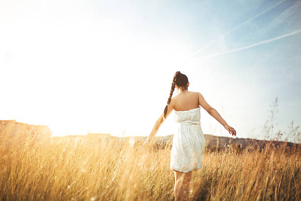 istock young woman in the field 545650940