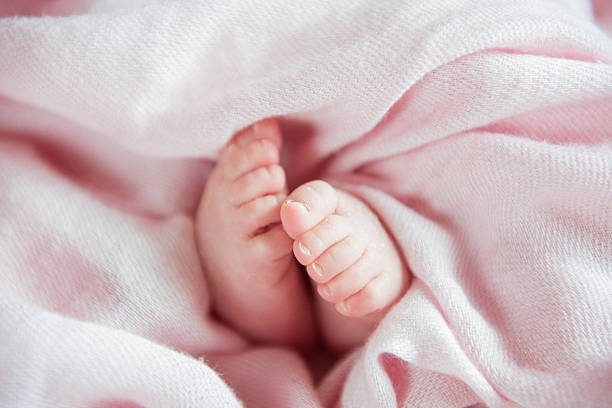 close up of Little baby feet on the bedFamily Love