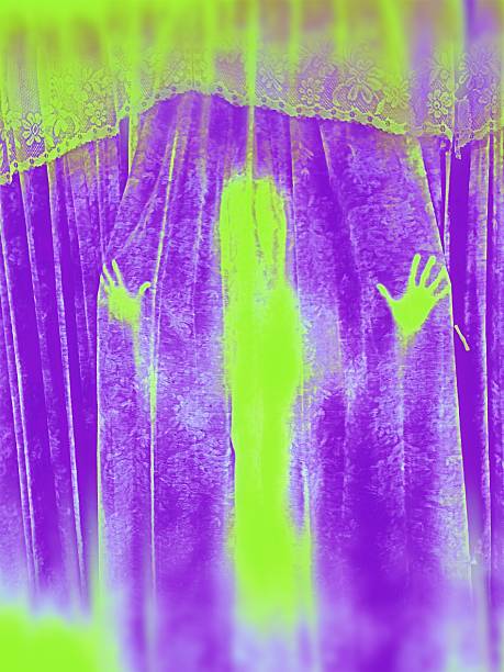 istock Ghostly neon green figurre behind purple curtain 545656404