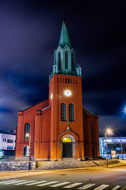 St. Peter Church or St. Petri Kirke St. Peter Church or St. Petri Kirke nicely lit at night time in Stavanger, Norway stavanger cathedral stock pictures, royalty-free photos & images