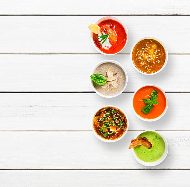 istock Variety of soups at white wood, top view 545656722