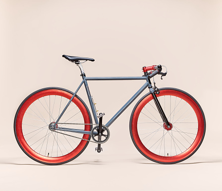 Trendy Grey and Red bicycle isolated on a beige background