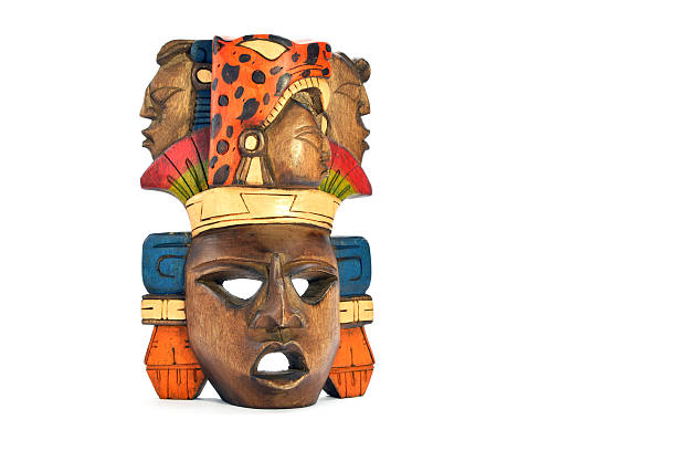 Indian Mayan Aztec wooden carved painted mask human profiles isolated on white background
