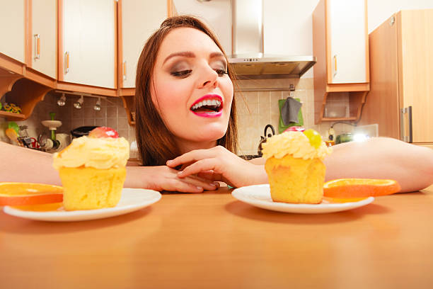 istock Woman looking at delicious sweet cake. Gluttony. 545659796