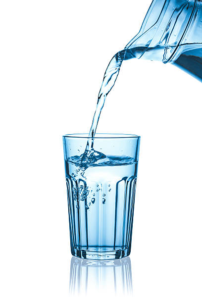istock faceted glass and a jug of water (isolated) 545660026