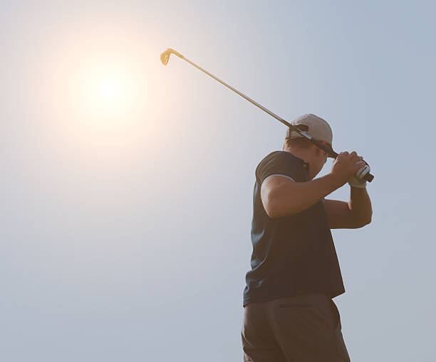 istock Young man playing golf, golfer hitting fairway shot, swinging cl 545660264