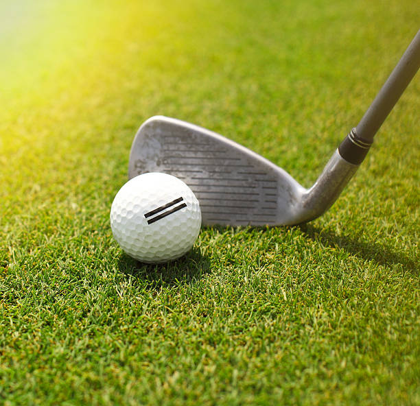 istock Golf player hitting ball into the whole 545660866