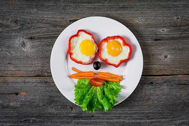 istock Smiling face made with food on a plate. Happy meal 545660880
