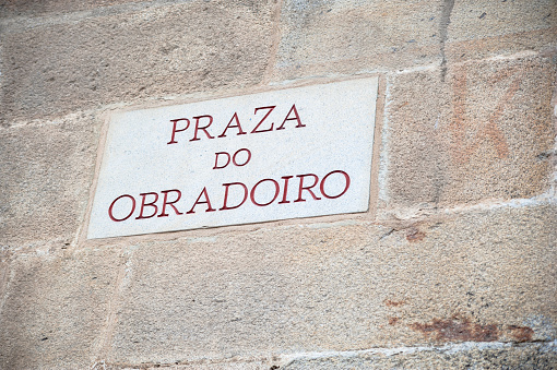 Sign for the Obradoiro Square written in the Galician language, Santiago de Compostela, Spain.