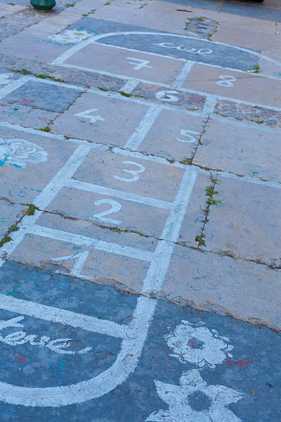 istock Hopscotch on an asphalt floor with chalk drawings 545661674