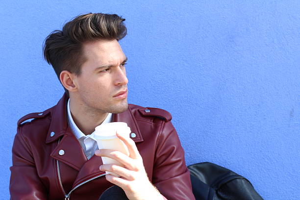 istock Modern man sitting outdoors with cup of tea 545662202