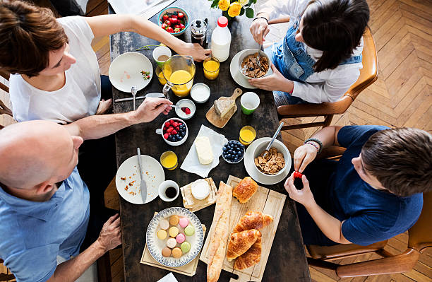istock Happy Family Having Breakfast together, Overhead View 545662724
