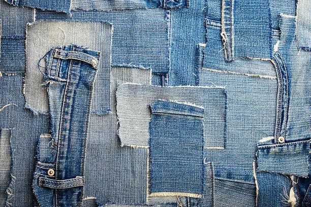 background made of old jeans rags close up