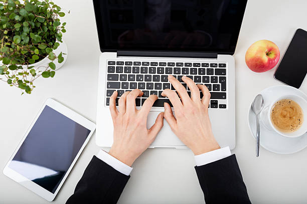 istock Woman Hands With Tablet, Laptop, Smartphone  and coffee 545664112