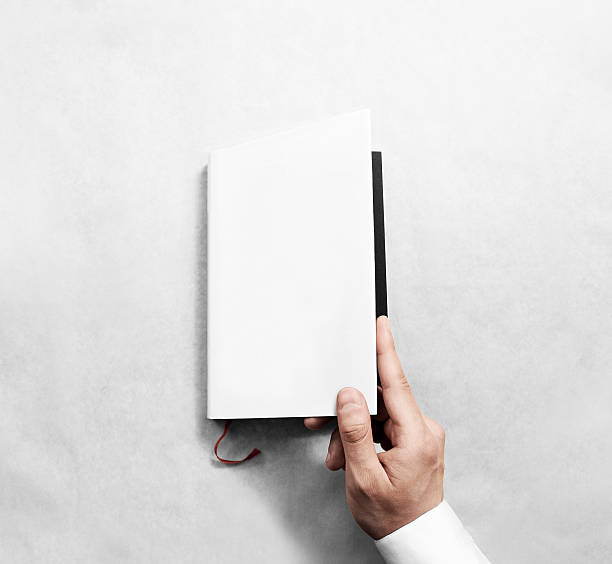 istock Hand opening blank white book cover mockup template. 545664812