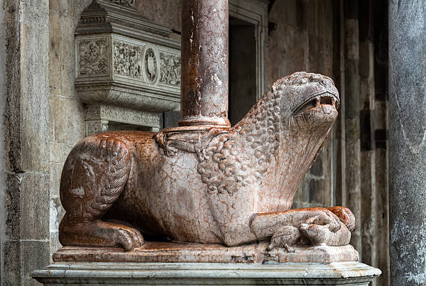 Medieval statue of a lion, Cremona, Italy stock photo