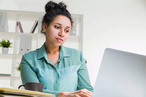 istock Black girl in office 545666408