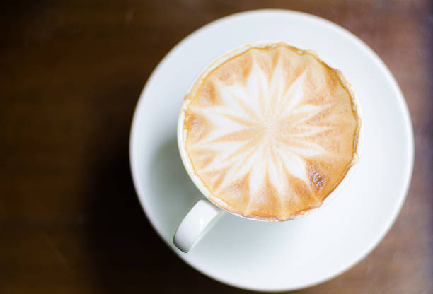 istock cup of coffee on old wooden desk 545669136