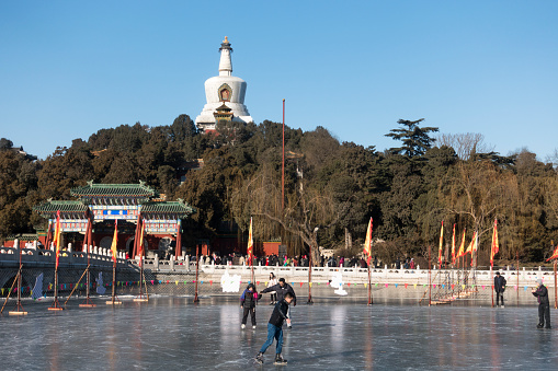 Beijing, China - January 7, 2016: Pepole skating on the ice of Beihai park