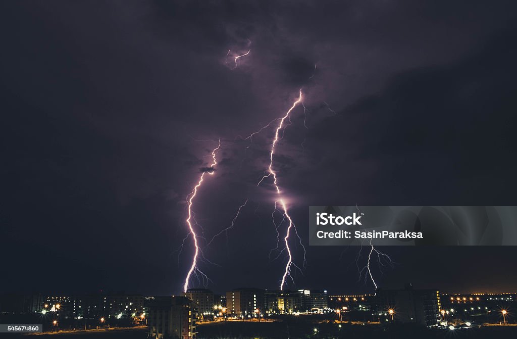 Lightning storm over countryside city at night in Thailand Accidents and Disasters Stock Photo