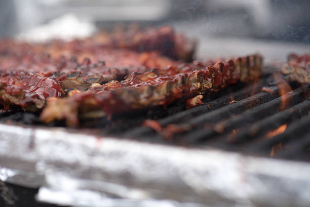 istock BBQ pork ribs on open grill smoke 545674892