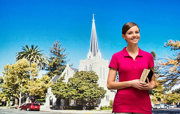 istock Smiling female in front of church 545677564