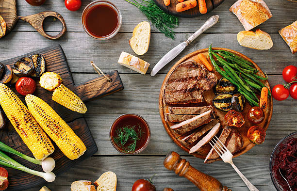 istock Juicy sliced grilled beef steak with various grilled vegetables 545679108